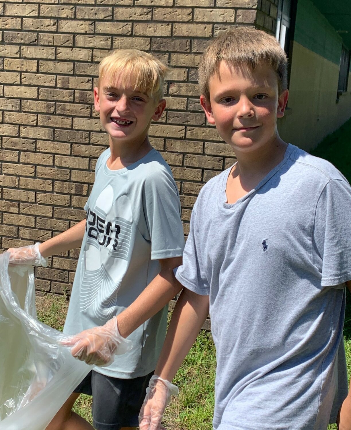 OPE student ambassadors participate in a school cleanup project at their first meeting.